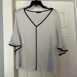 White blouse with black trim